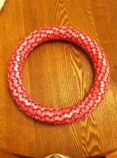 Fully wrapped ribbon wreath.